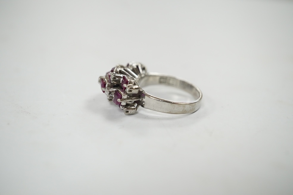 An 18k white metal, ruby and diamond cluster set cocktail ring, size K/L, gross weight 5.7 grams. Condition - fair to good